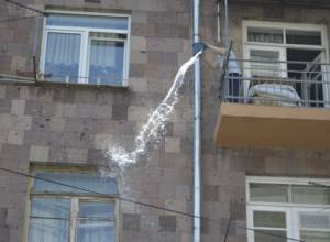 Resident pours water on policemen