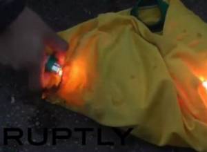 Brazilian fans burns their national team shirts