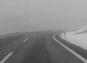 Vehicles stranded on iced-over road 
