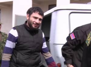 Police officers escort member of Sasa Dzrer group even during his treatment