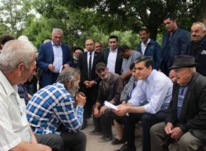 Villagers present their problems to Defender