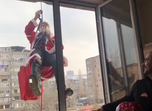 Santa Claus visits children in hospital through window